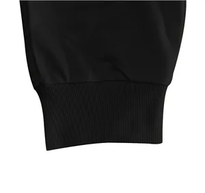 Detailed macro view showing the elastic ribbed cuff of black men's casual sweatpants