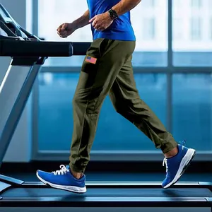 Side view of men's olive green joggers featuring an American flag patch for gym wear