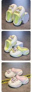 Close-up detail of cute cartoon character charms on comfortable girls' summer beach clogs