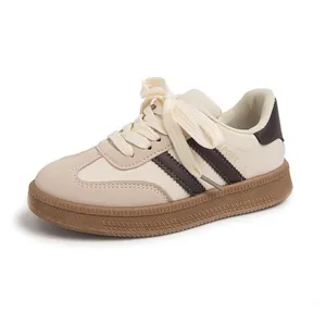 Vintage German army trainer sneakers for women in cream and stylish brown accents