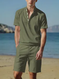 Close-up detail of a men's olive green cotton linen Henley shirt and shorts beach outfit