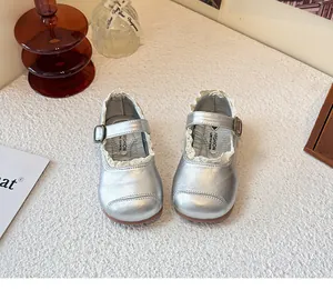 Elegant silver girl's princess shoes featuring delicate lace trim and soft soles.