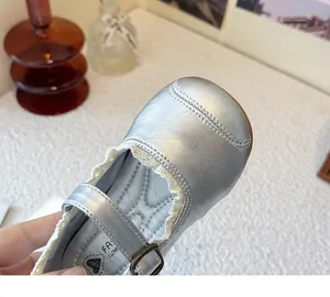 Detailed close-up view of silver girls' Mary Jane princess shoes with delicate lace trim