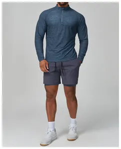 Detailed view of the men's blue slim-fit quarter-zip long-sleeve quick-dry sports top
