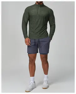 Front view of male model wearing green slim-fit long-sleeved athletic training top
