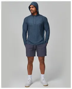 Detailed macro view showing the textured blue fabric and half-zip of men's fitness hoodie