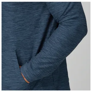 Close-up of men's quick-drying blue jacket showing fabric texture and pocket detail.