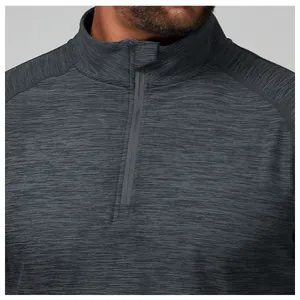 Close-up of the quarter-zip collar and textured fabric on the grey athletic shirt