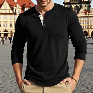 Men's black long-sleeve Henley shirt with chest pocket in casual outdoor setting.