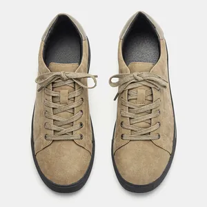 Men's stylish tan suede casual sneakers with black soles and lace-up closure detail