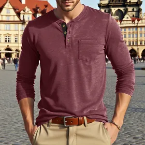 Detail view of a men's maroon long-sleeved Henley t-shirt with front pocket and buttons