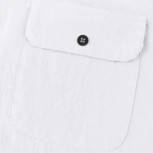 Macro detail view of white linen men's Henley shirt chest pocket with black button