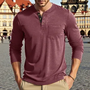 Detail shot of men's burgundy long-sleeve Henley shirt with pocket in soft cotton fabric