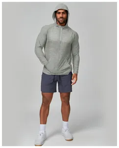 Men's grey heathered half-zip hooded running jacket with front kangaroo pocket.