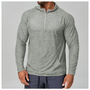 Close-up detail of men's grey heathered quick-dry hooded performance top with half-zip