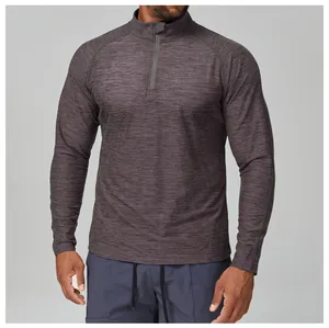 Detail of grey heathered slim fit men's long sleeve sports shirt with half-zip collar