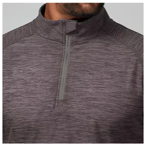 Close-up detail of a men's half-zip athletic top showing the grey marled fabric texture