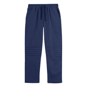 Detail view of navy blue men's loose linen trousers with unique pleated knee texture