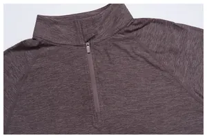 Close-up of men's athletic quick-dry long sleeve top with quarter-zip collar detail