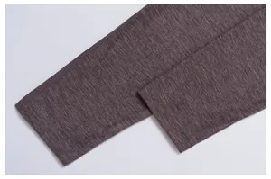 Detailed view of the quick-dry fabric and flatlock stitching on the athletic shirt hem.