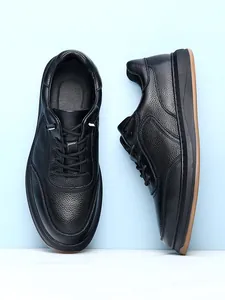 Black top-grain cowhide men's casual leather shoes with non-slip soft soles from two views.
