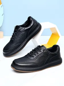 Detailed view of black breathable cowhide leather casual shoes with non-slip soft soles.