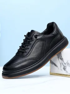 Detail view of black genuine leather men's casual sneaker with no-tie elastic laces