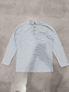 High-quality gray long-sleeved Henley t-shirt featuring a front pocket and button placket
