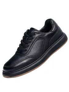 Detailed side view of black genuine leather men's casual sneakers with pebble texture