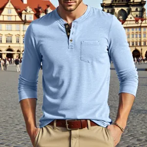 Detailed view of a light blue long-sleeved men's Henley shirt with a chest pocket