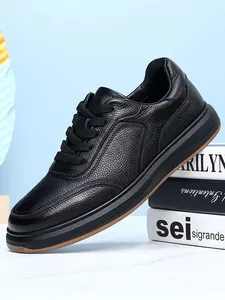 Detailed side view of black genuine grain leather men's casual shoes with thick soles