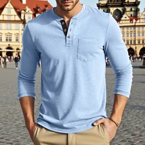 Close-up detail of light blue long-sleeve Henley shirt featuring a pocket and button placket