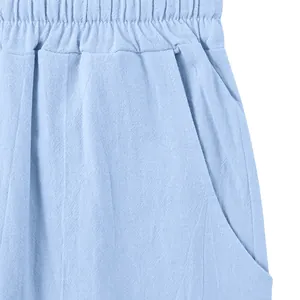 Detail showing the elastic waistband and side pocket of light blue linen-textured men's trousers