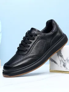 Close-up of men's black top-layer cowhide leather casual shoes with breathable holes.