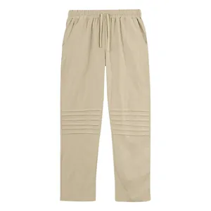 Front view of men's loose linen pants with unique pleated knee design and drawstring waist.