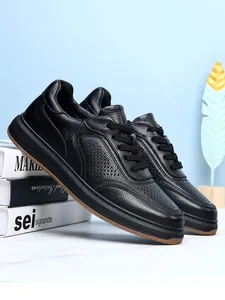 Macro detail of men's breathable black genuine cowhide leather slip-on sneakers