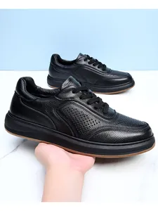 Side view of black pebbled leather men's casual shoes with breathable perforations