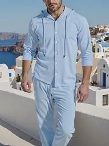 Macro view showing the detailed linen-like fabric texture of the light blue hooded men set