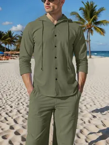 Macro view of the olive green linen fabric texture on men's hooded shirt set