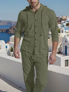 Detailed shot of olive green linen hooded shirt and pants set in outdoor setting