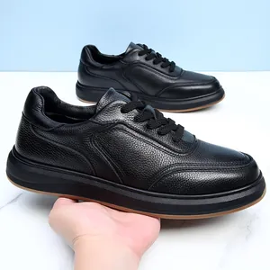 Close-up of black cowhide leather casual men's shoes showing texture and soft sole.
