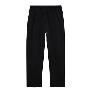 Close-up of men's loose fit black linen trousers featuring a comfortable straight leg cut