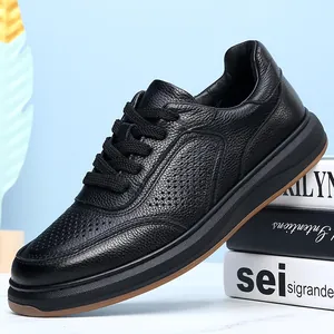 Detailed view of black genuine cowhide men's sneakers with premium pebble grain texture.