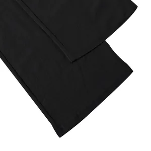 Close-up detail of the hem and stitching on men's loose black linen straight pants