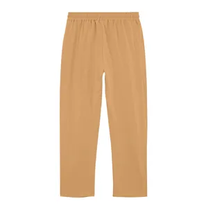Detail view of men's loose fit linen trousers in tan color with elastic waistband