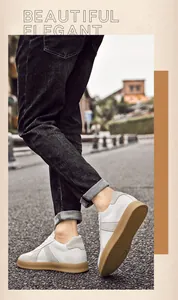 Stijlvolle witte leren German Army Trainers met gomzool getoond op mannelijk model