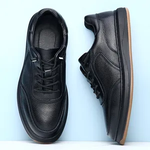 Side and top view detail of black genuine leather men's casual shoes with soft soles.