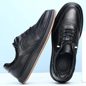 Close-up of black cowhide leather casual shoes with elastic laces and soft sole.