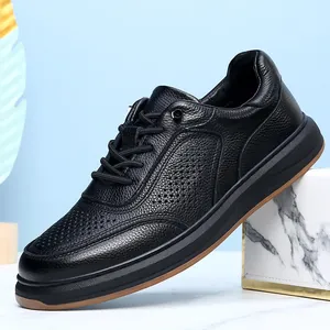 Detail view of premium black leather casual shoe with breathable perforated texture