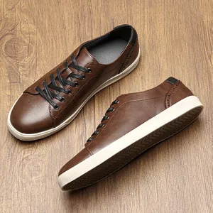 Detailed view of brown retro men's sneakers showing sole and side profile textures
